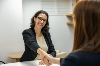 Candidate shaking hands with a recruiting manager after an interview